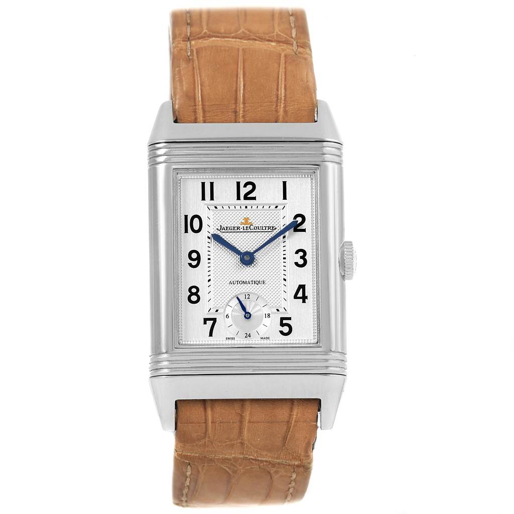 This Jaeger LeCoultre Reverso Q3808420 Men's Stainless Steel Silver Dial Q3808420 Men's Stainless Steel Silver Dial watch is shown from a front angle, displaying its rectangular face, dial, hands, and tan leather strap.
