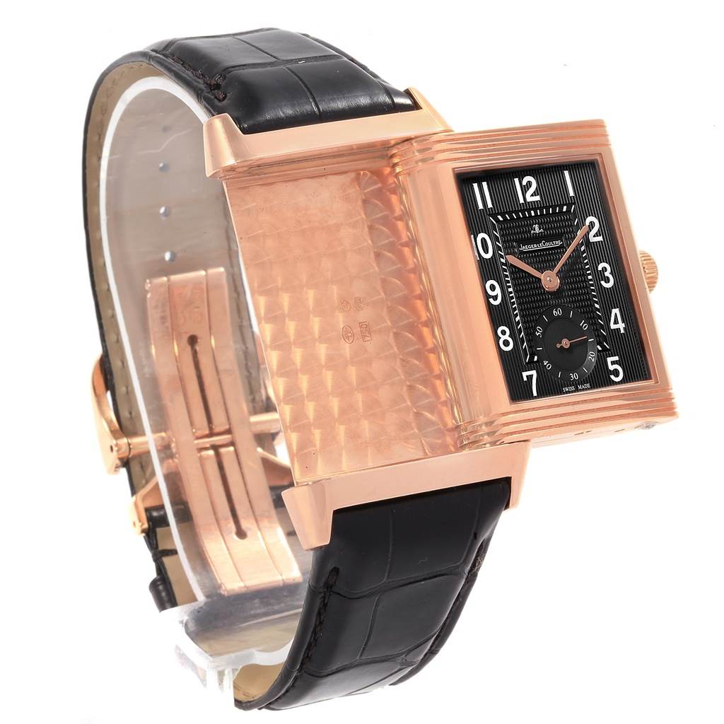 The image shows a Jaeger LeCoultre Reverso Q3732470 Men's Rose Gold Black Dial Q3732470 Men's Rose Gold Black Dial watch at an angle revealing both the dial and the inner case, with a black leather strap.
