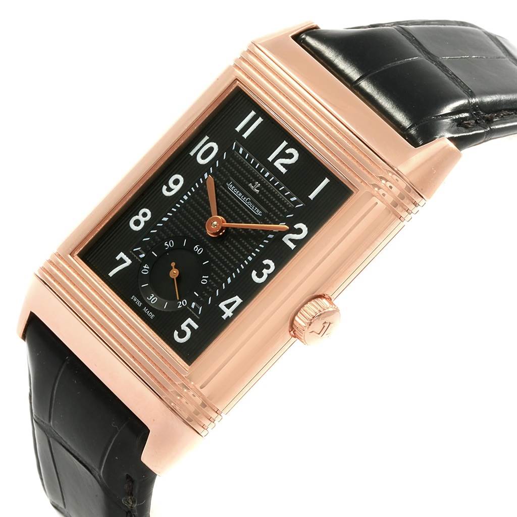 The image shows an angled view of a Jaeger LeCoultre Reverso Q3732470 Men's Rose Gold Black Dial Q3732470 Men's Rose Gold Black Dial model with a black dial, rose gold case, and black leather strap.