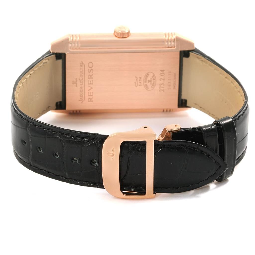 The image shows the back view of a Jaeger LeCoultre Reverso Q3732470 Men's Rose Gold Black Dial Q3732470 Men's Rose Gold Black Dial watch, highlighting the case back and black leather strap with a buckle.