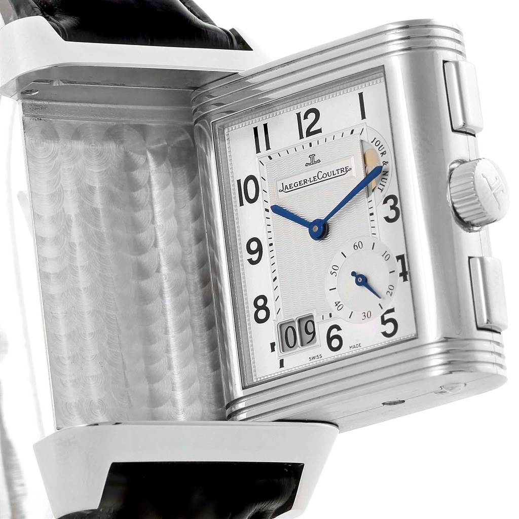 The image shows the Jaeger LeCoultre Reverso Q3028420 Men's Stainless Steel Silver Dial Q3028420 Men's Stainless Steel Silver Dial watch partially rotated, displaying the front face with Arabic numerals, a subdial, and the crown.