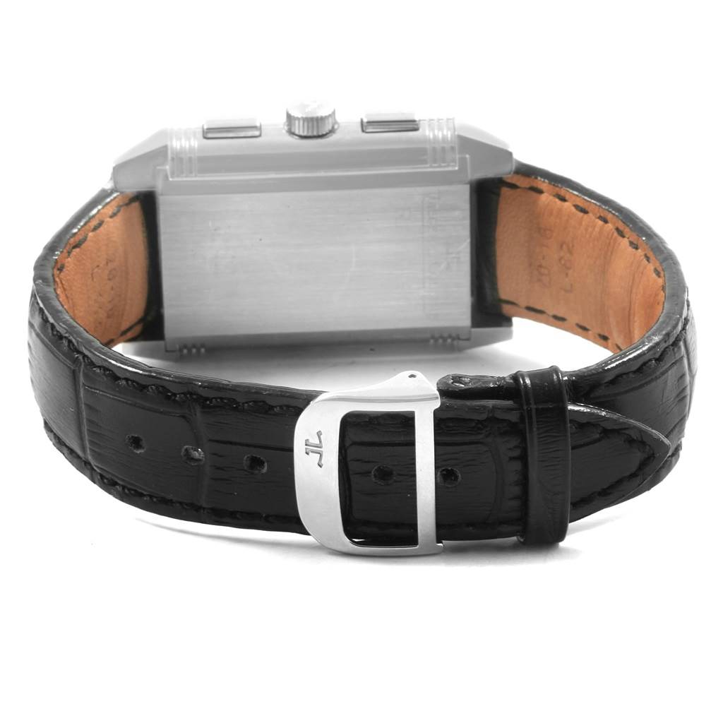 The image shows the Jaeger LeCoultre Reverso Q3028420 Men's Stainless Steel Silver Dial Q3028420 Men's Stainless Steel Silver Dial watch's metal back case and black leather strap with a buckle.