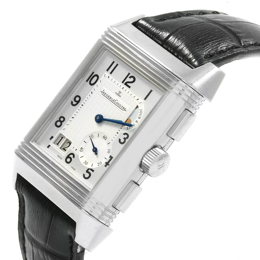 The Jaeger LeCoultre Reverso Q3028420 Men's Stainless Steel Silver Dial Q3028420 Men's Stainless Steel Silver Dial watch is shown at an oblique angle, highlighting its face, crown, strap, and case.