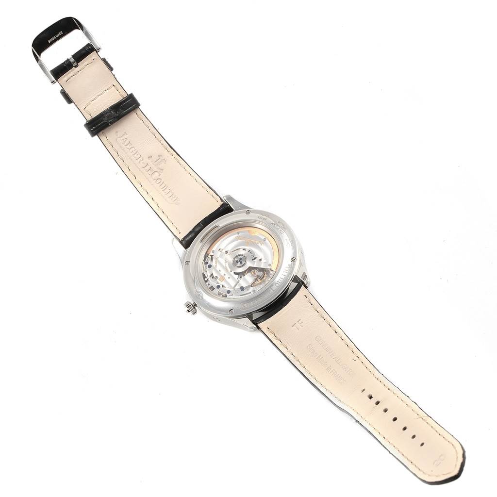 The image shows the Jaeger LeCoultre Master Q1558420 Men
s Stainless Steel Silver Dial Q1558420 Men
s Stainless Steel Silver Dial model watch from the back, displaying its inner mechanism and beige leather strap.