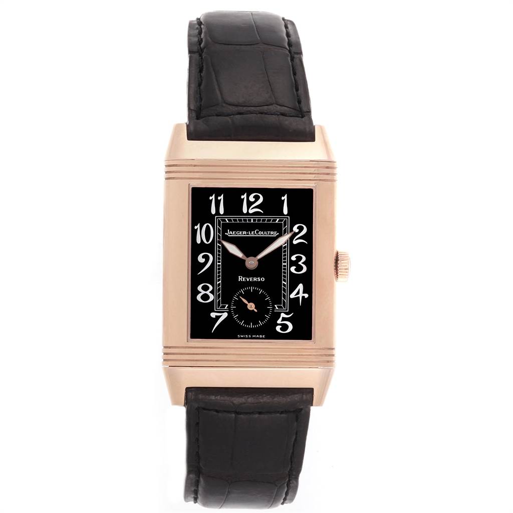 The image shows a front view of the Jaeger-LeCoultre Reverso watch, featuring its rectangular case, black dial, and leather strap.