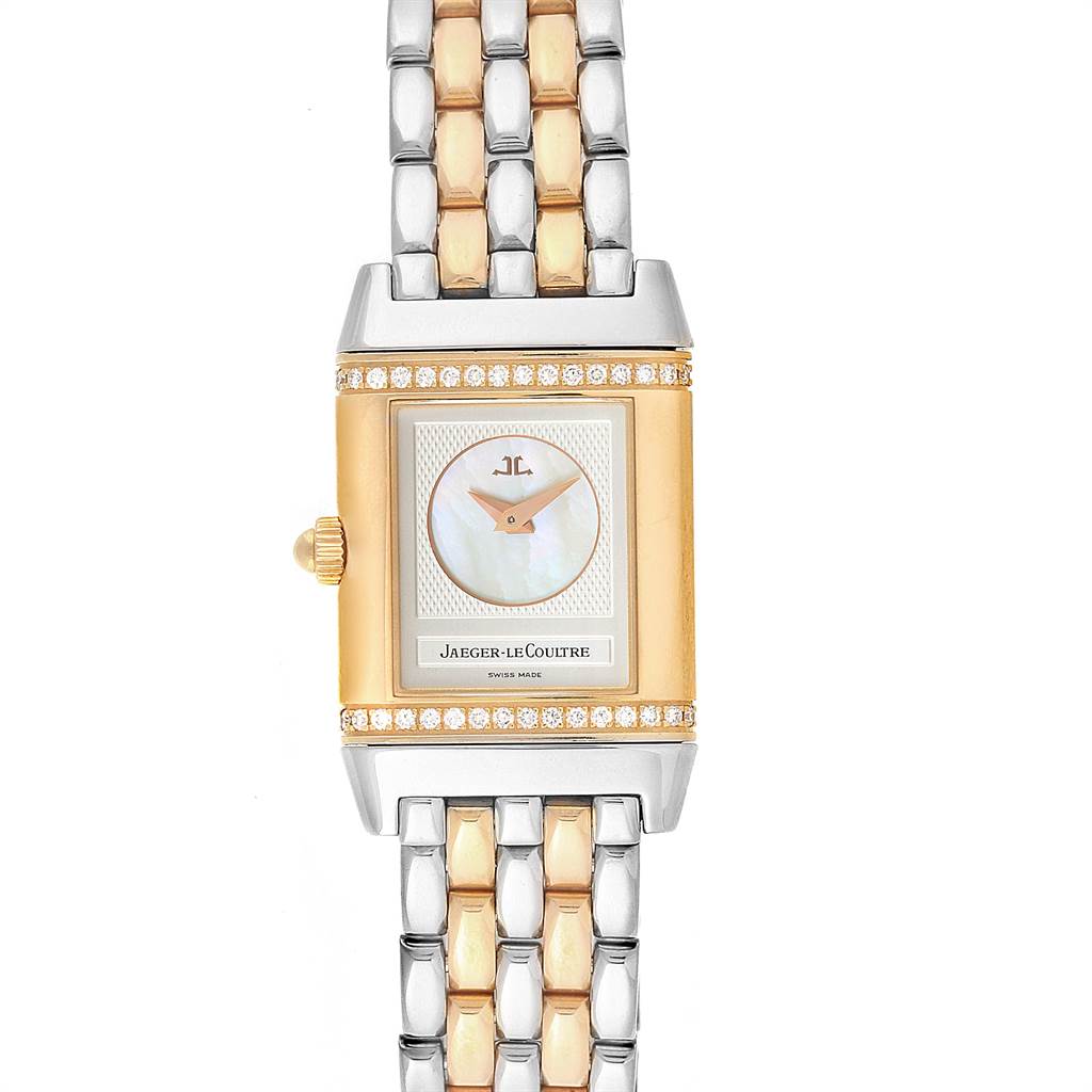 The image shows a front view of the Jaeger-LeCoultre Reverso watch with a two-tone bracelet and diamond accents.