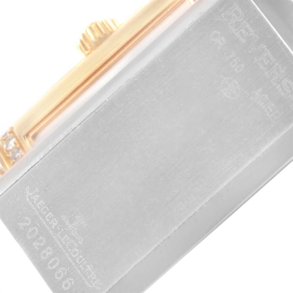 The image shows a close-up angled view of the back casing and crown of a Jaeger-LeCoultre Reverso watch.