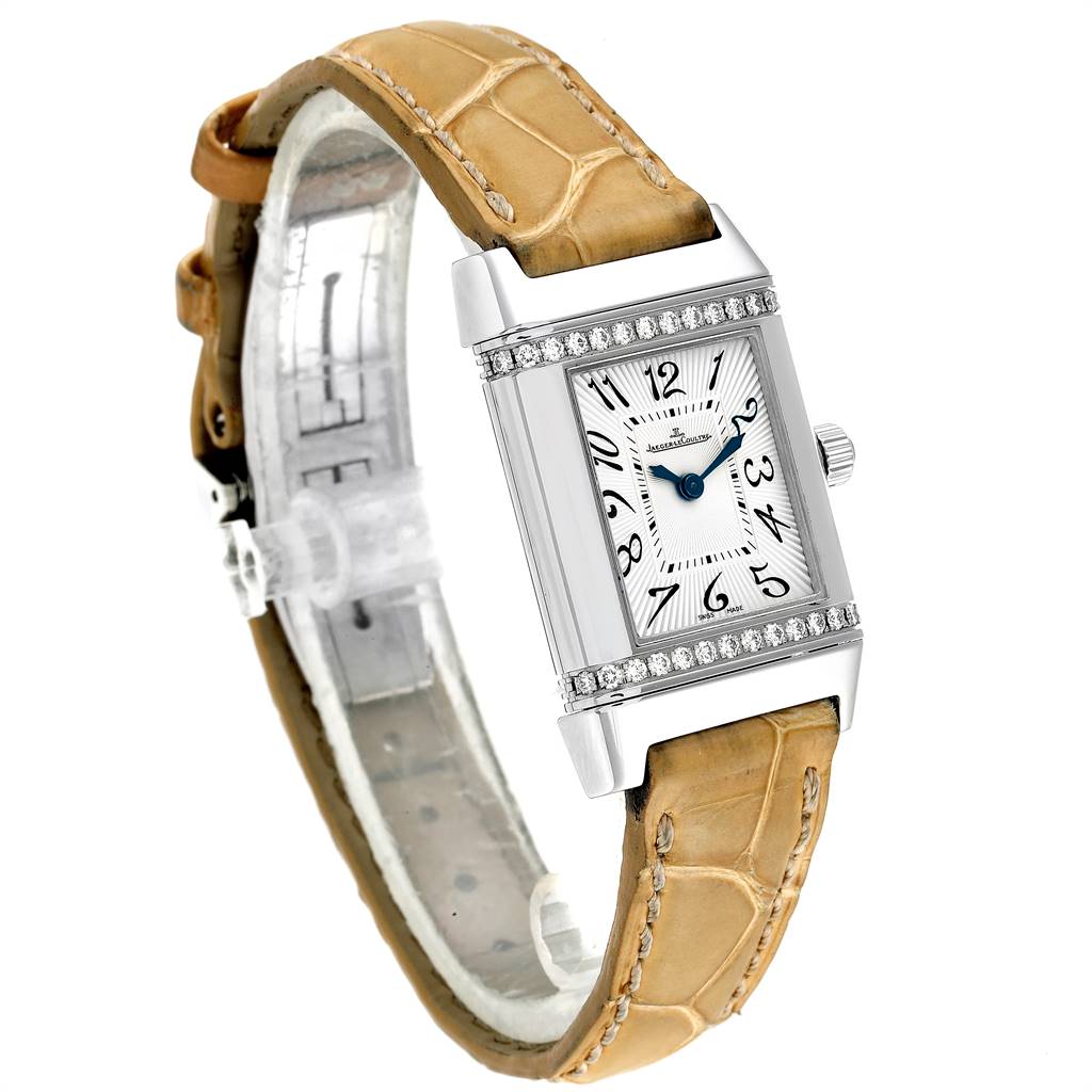 The image shows a Jaeger LeCoultre Reverso Q2658430 Women's Stainless Steel Silver Dial Q2658430 Women's Stainless Steel Silver Dial model watch at a three-quarter angle, displaying the face, bezel, crown, and leather strap.