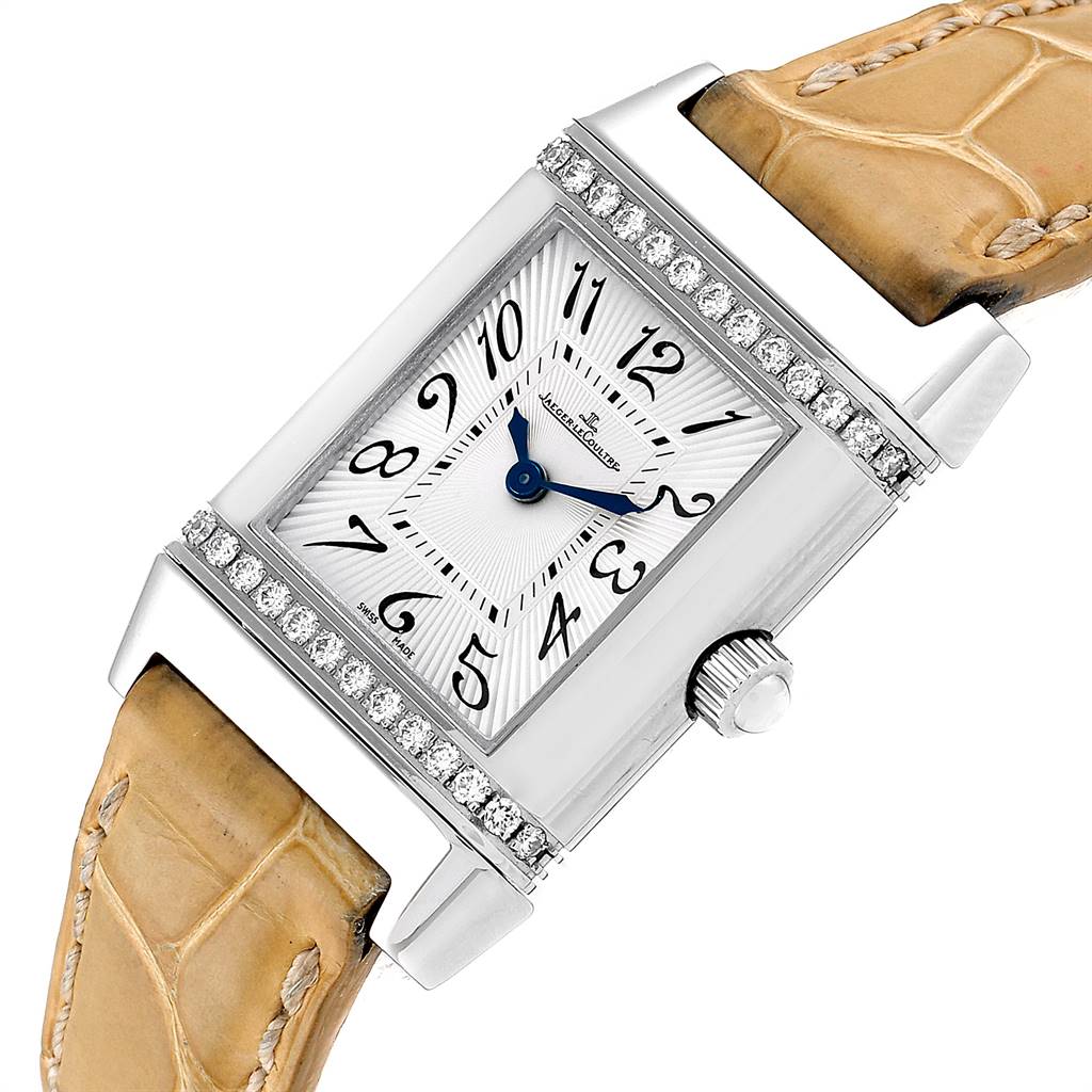 This image shows a close-up angle of the Jaeger LeCoultre Reverso Q2658430 Women's Stainless Steel Silver Dial Q2658430 Women's Stainless Steel Silver Dial watch, highlighting the dial, diamond bezel, crown, and leather strap.