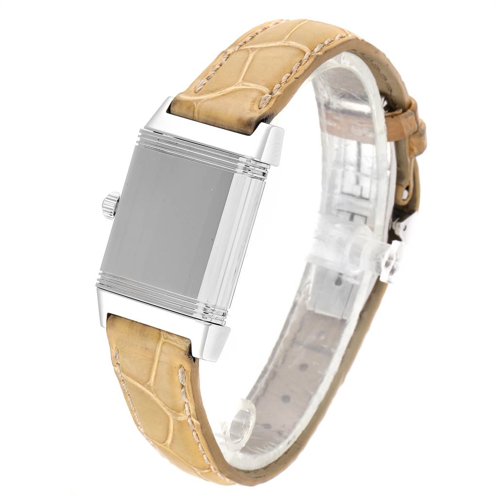 This image shows a side view of a Jaeger LeCoultre Reverso Q2658430 Women's Stainless Steel Silver Dial Q2658430 Women's Stainless Steel Silver Dial watch with a beige leather strap and a blank case.