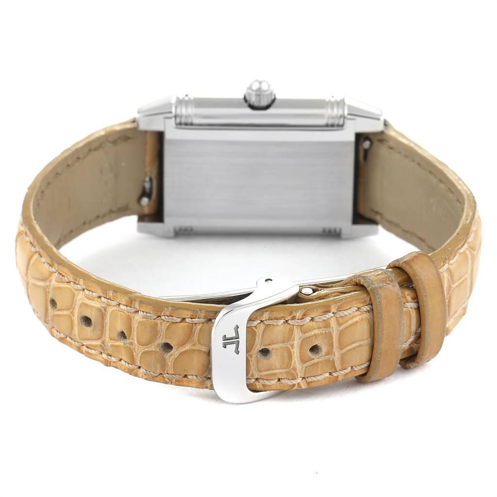 The image shows the back view of a Jaeger LeCoultre Reverso Q2658430 Women's Stainless Steel Silver Dial Q2658430 Women's Stainless Steel Silver Dial watch with a beige leather strap and clasp.
