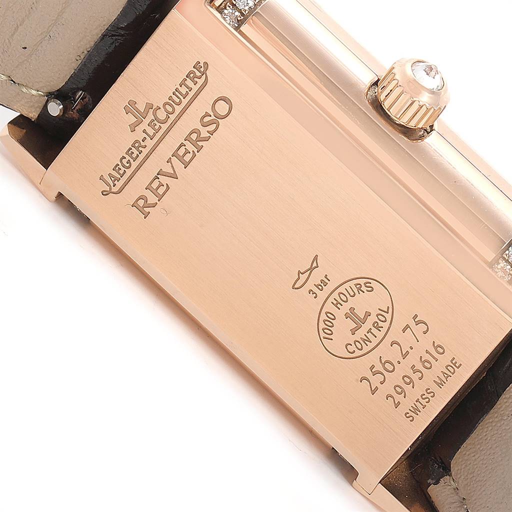 The image shows the back case and side view of a Jaeger LeCoultre Reverso Q2562402 Women's Rose Gold Silver Dial Q2562402 Women's Rose Gold Silver Dial watch, displaying the engraved model details and crown.