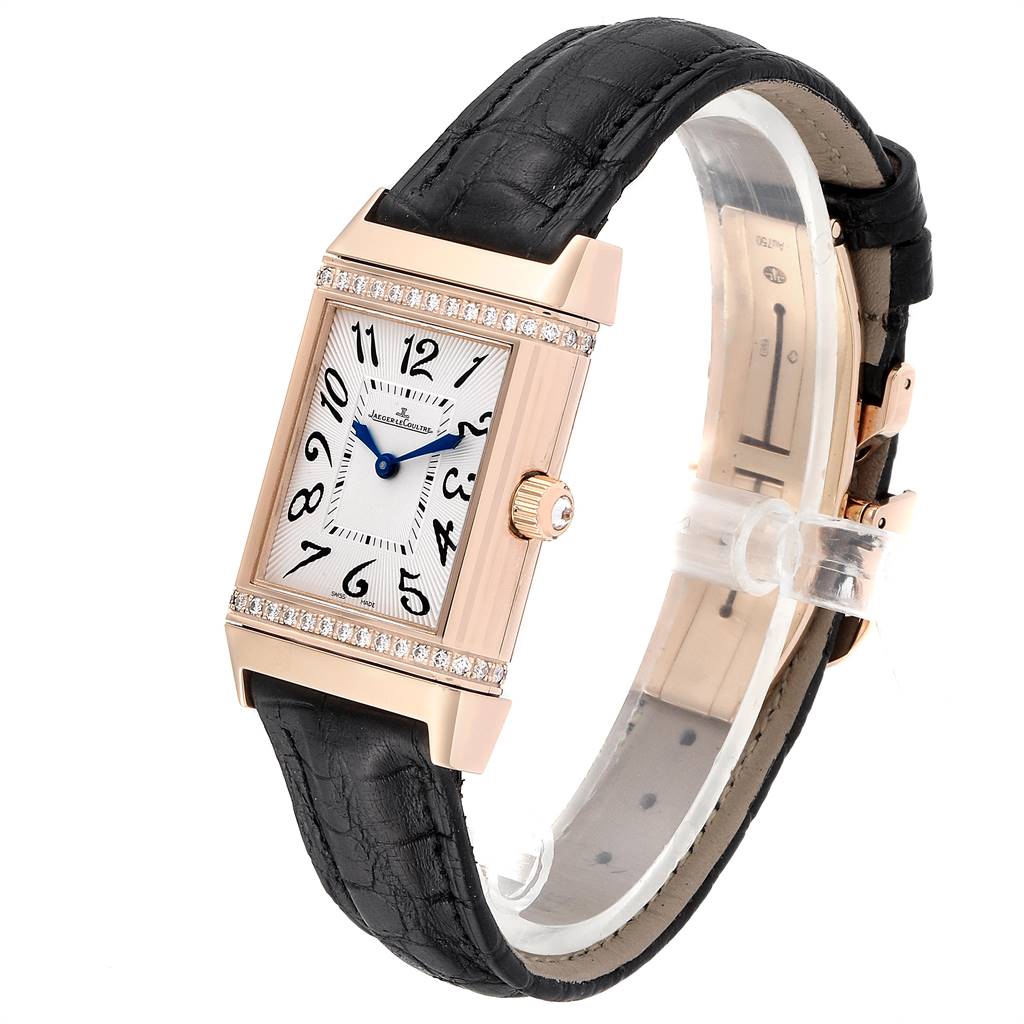 This Jaeger LeCoultre Reverso Q2562402 Women's Rose Gold Silver Dial Q2562402 Women's Rose Gold Silver Dial watch is shown at a three-quarter angle, highlighting its rectangular face, black leather strap, and side crown.