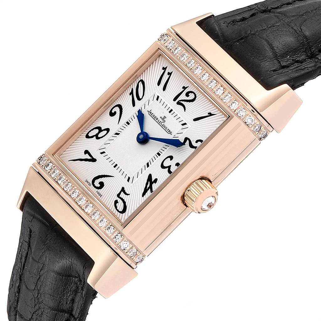 The image shows a close-up angled view of a Jaeger LeCoultre Reverso Q2562402 Women's Rose Gold Silver Dial Q2562402 Women's Rose Gold Silver Dial watch, highlighting the dial, crown, and leather strap.
