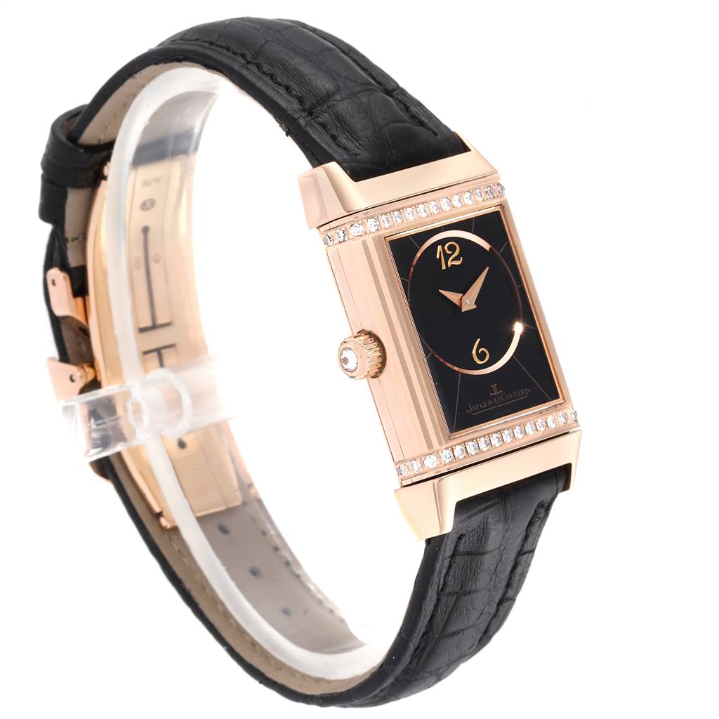 This image shows a Jaeger LeCoultre Reverso Q2562402 Women's Rose Gold Silver Dial Q2562402 Women's Rose Gold Silver Dial watch at a three-quarter angle, highlighting its black leather strap, rectangular dial, and side crown.