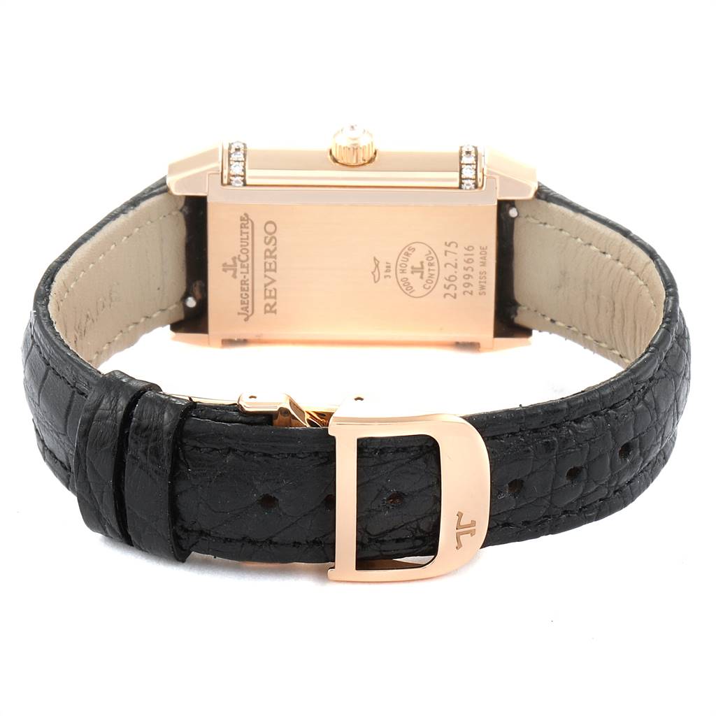 The image shows the back of a Jaeger LeCoultre Reverso Q2562402 Women's Rose Gold Silver Dial Q2562402 Women's Rose Gold Silver Dial watch, highlighting the black leather strap and rose gold clasp.