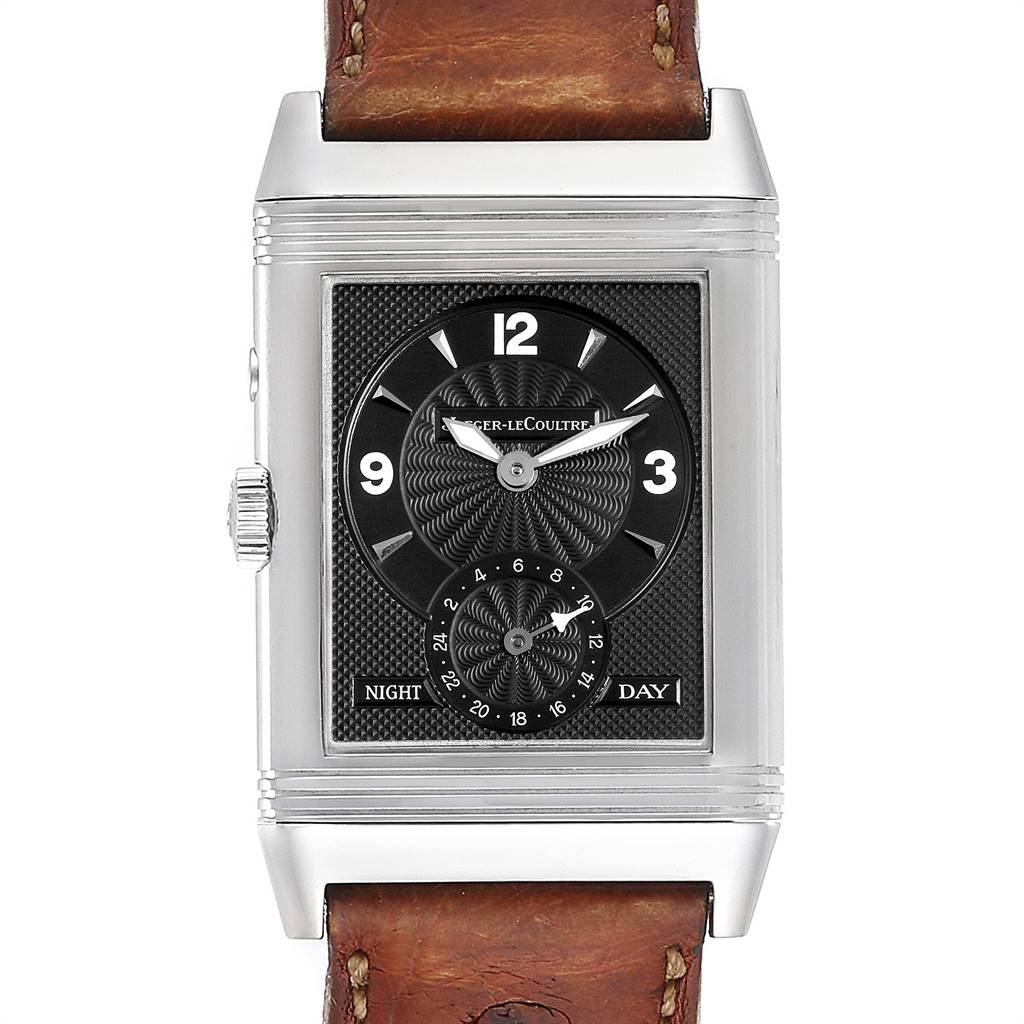 The image shows a Jaeger-LeCoultre Reverso watch from a front angle, displaying its face and leather strap.
