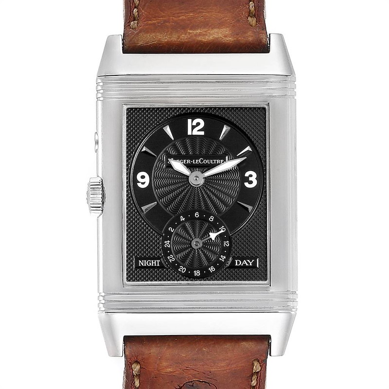 The image shows a Jaeger-LeCoultre Reverso watch from a front angle, displaying its face and leather strap.