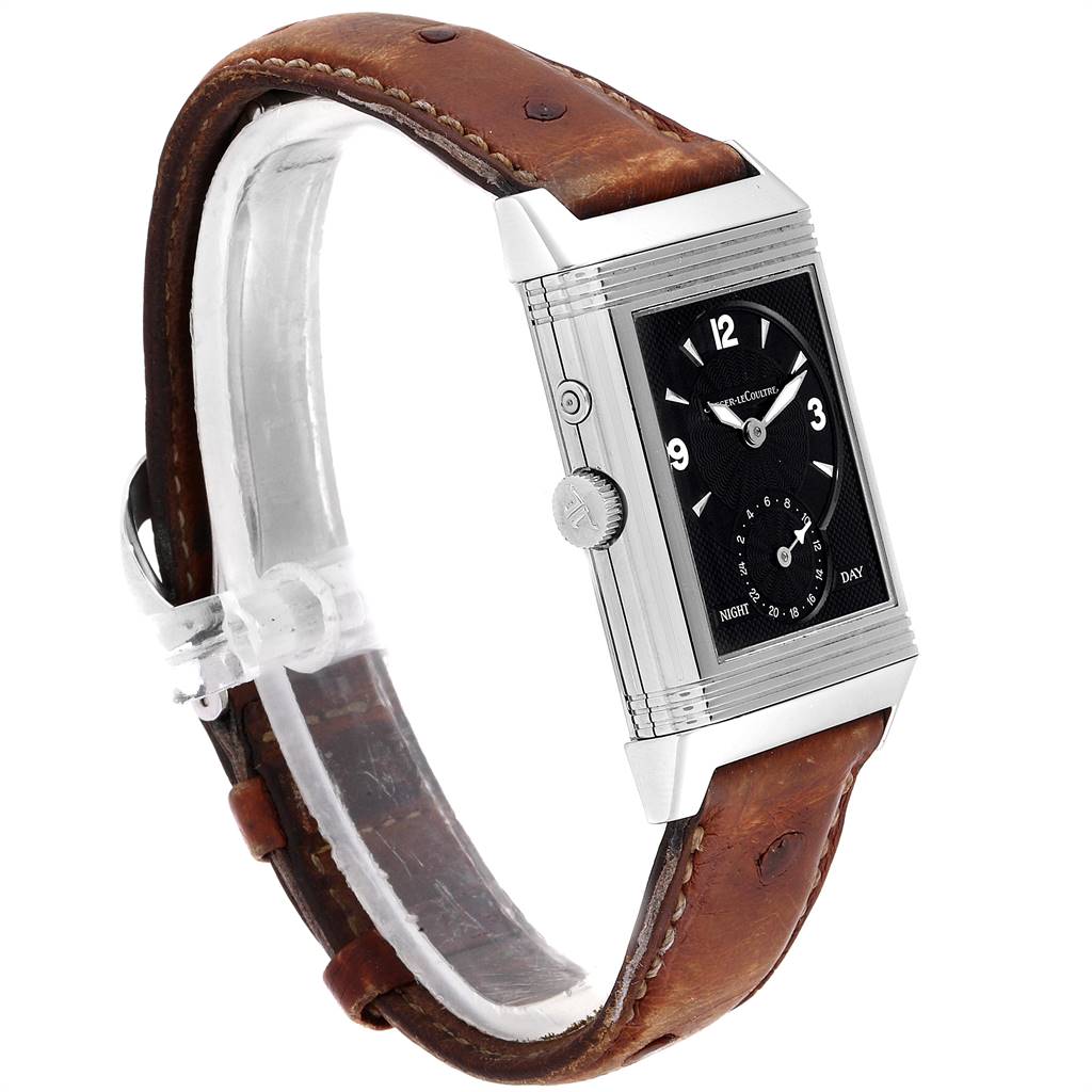 The image shows a side profile of a Jaeger-LeCoultre Reverso watch with a brown leather strap and a black dial.