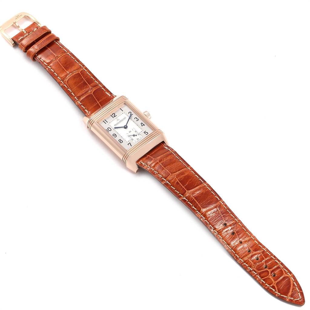 This image shows a Jaeger-LeCoultre Reverso watch, featuring a rectangular face and a brown leather strap, viewed from above.