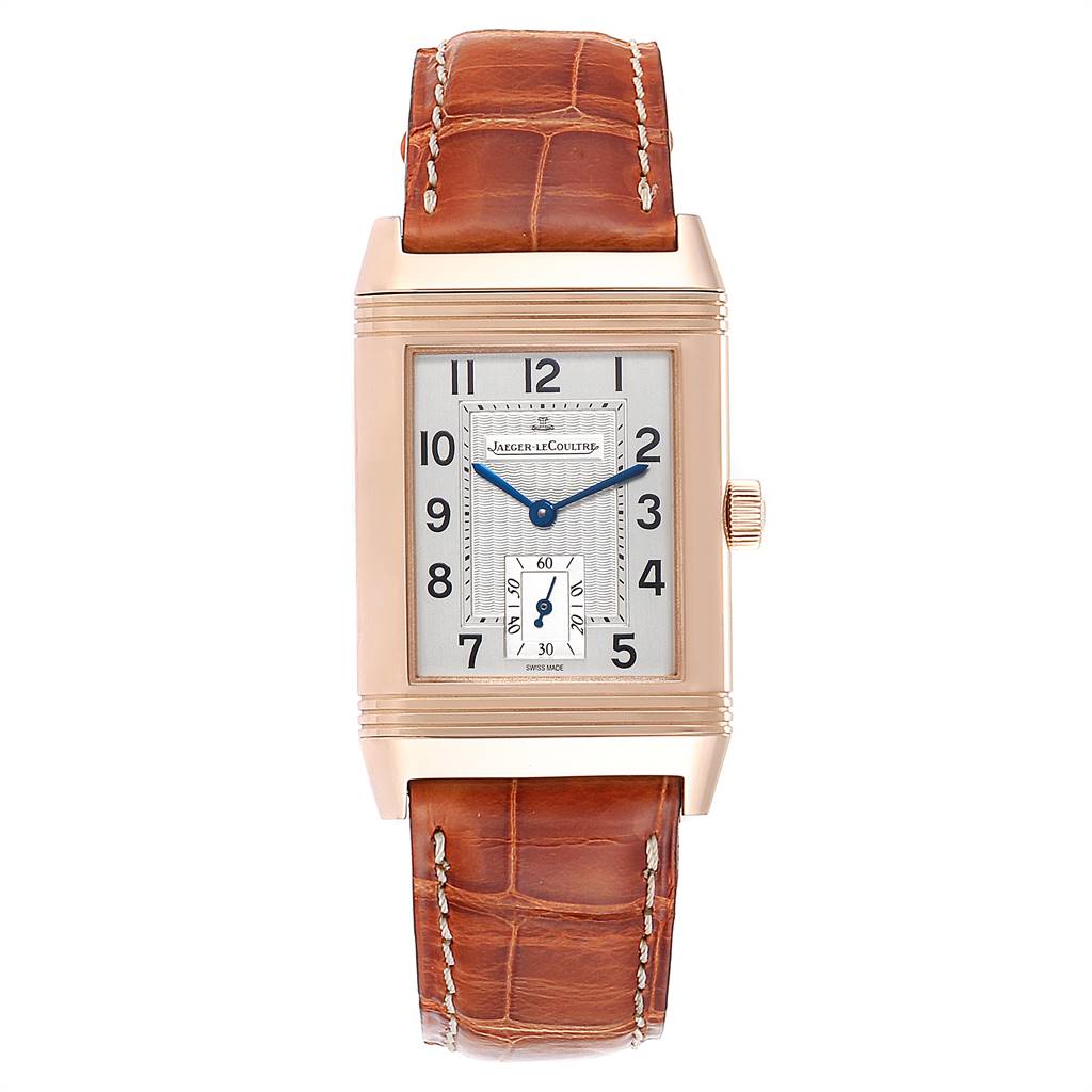 The image shows a front view of the Jaeger-LeCoultre Reverso watch, displaying its dial, hands, and brown leather strap.