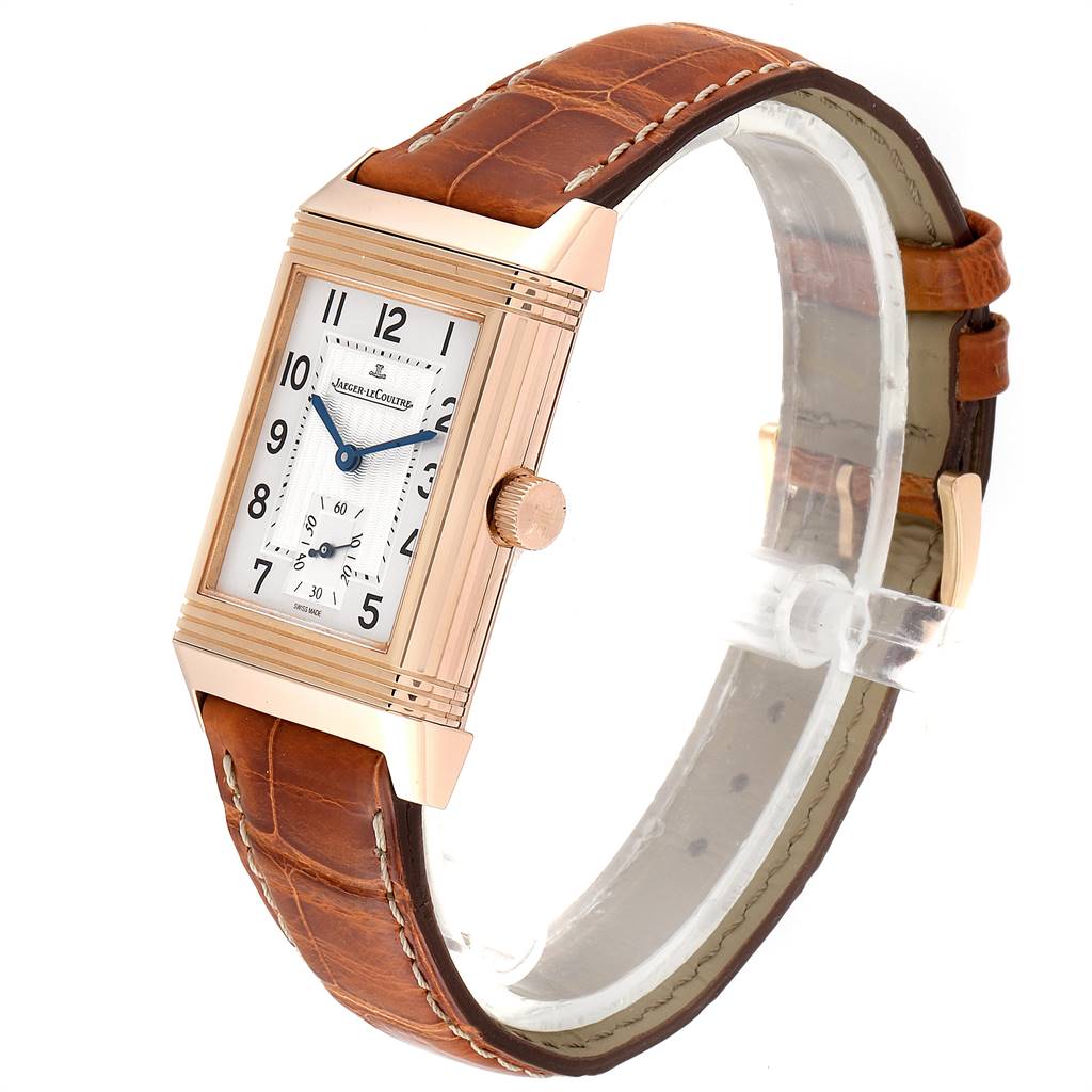 The image shows a Jaeger LeCoultre Reverso 270.2.62 Men's Rose Gold Silver Dial 270.2.62 Men's Rose Gold Silver Dial watch at a slight angle, highlighting its rectangular face, crown, and brown leather strap.