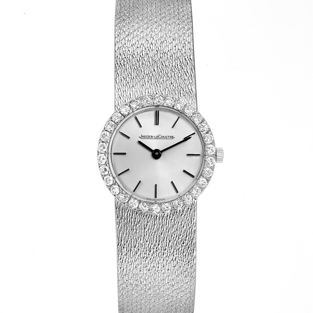 The image shows a front view of a vintage Jaeger LeCoultre watch featuring a textured band and a diamond-studded bezel.