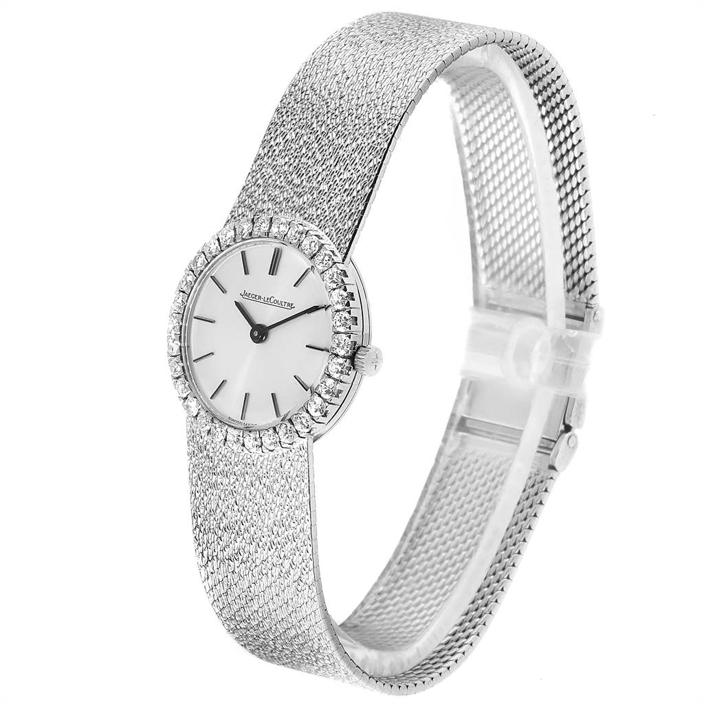 This Vintage Jaeger LeCoultre watch is shown at a three-quarter angle, featuring its dial, face, and mesh bracelet.