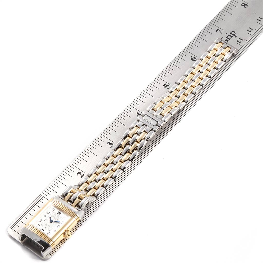 The image shows a Jaeger LeCoultre Reverso Q266511F Women's Steel and Gold (two tone) Mother of Pearl Dial Q266511F Women's Steel and Gold (two tone) Mother of Pearl Dial watch from a top-down angle, placed next to a ruler for scale.