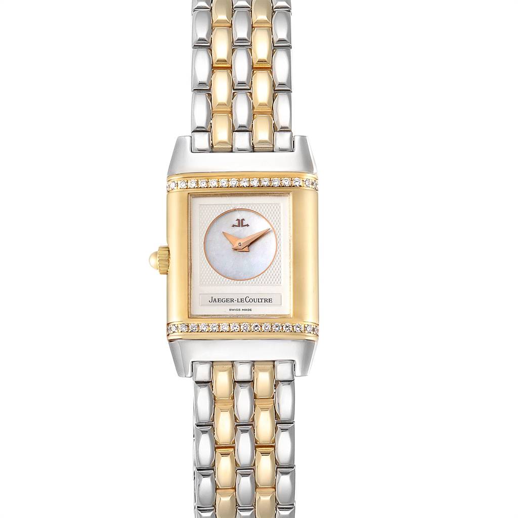 The image shows a front view of the Jaeger-LeCoultre Reverso watch, highlighting its rectangular face, bracelet, and gold details.