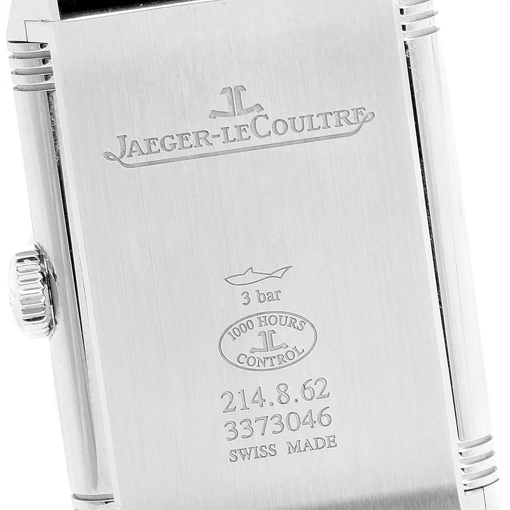 This is a close-up of the case back of a Jaeger-LeCoultre Reverso watch, showing the logo, model number, and other detailing.