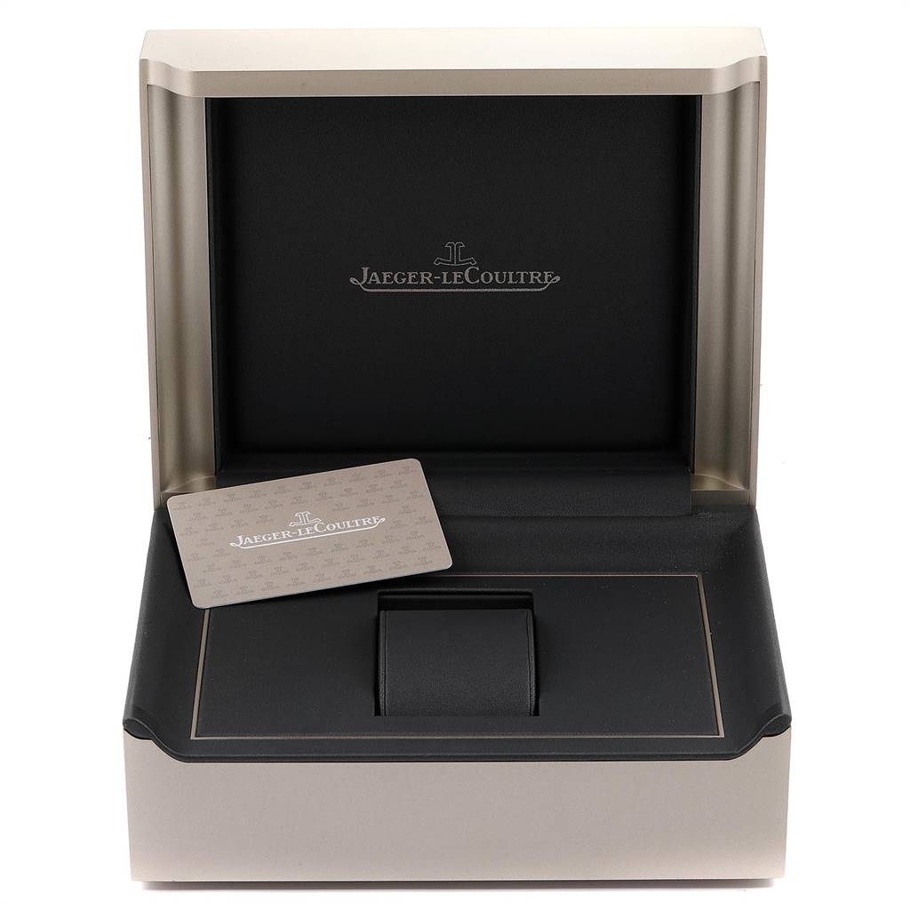 The image shows the open box of a Jaeger-LeCoultre Reverso watch, along with a branded card.