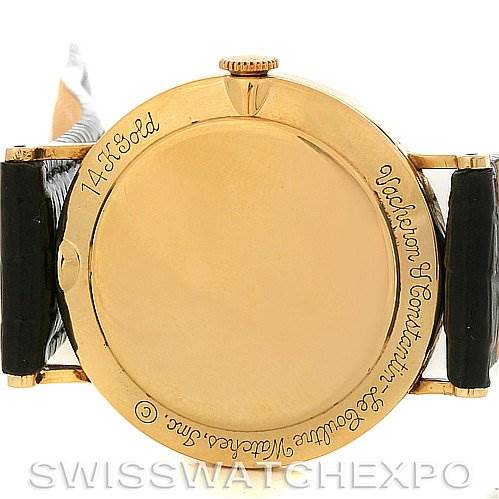 The image shows the back case of a Vintage Vacheron Constantin watch, highlighting the gold material and brand engraving.