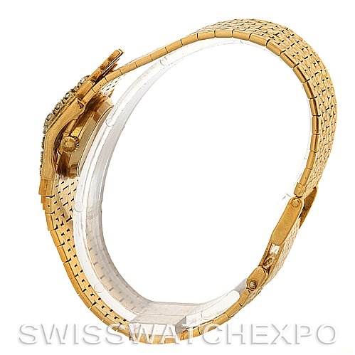 This image shows the side profile of a Vintage Jaeger LeCoultre watch, highlighting its gold band and crown.