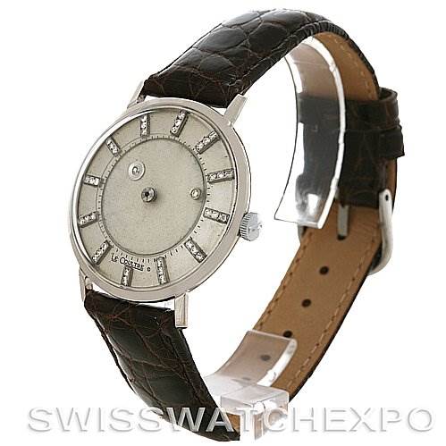 The image shows a side view of the vintage Jaeger LeCoultre watch with a focus on the face, case, and leather strap.