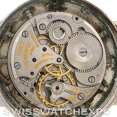 This image shows the intricate inner mechanism of a Jaeger LeCoultre Vintage White Gold Silver Dial White Gold Silver Dial watch, focusing on gears, jewels, and movement components.