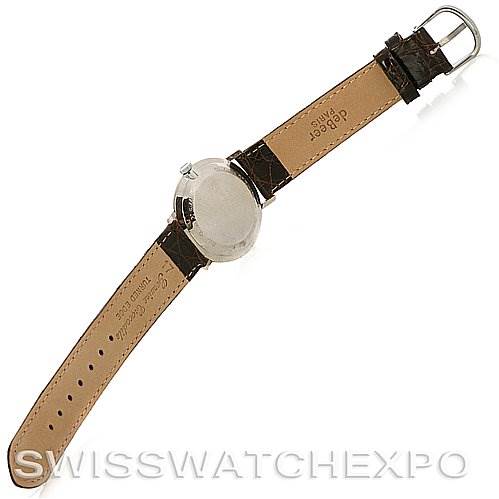 The image shows a Vintage Jaeger LeCoultre watch from a top view, displaying the back case and leather strap.