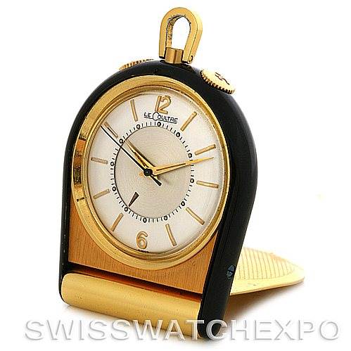 This image shows a Jaeger LeCoultre Vintage Yellow Gold Silver Dial Yellow Gold Silver Dial watch in a standing position, highlighting its face, crown, and stand.