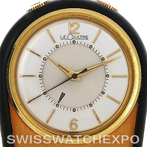 This image shows a close-up of the dial and bezel of a Vintage Jaeger LeCoultre watch, featuring gold-tone hands and hour markers.