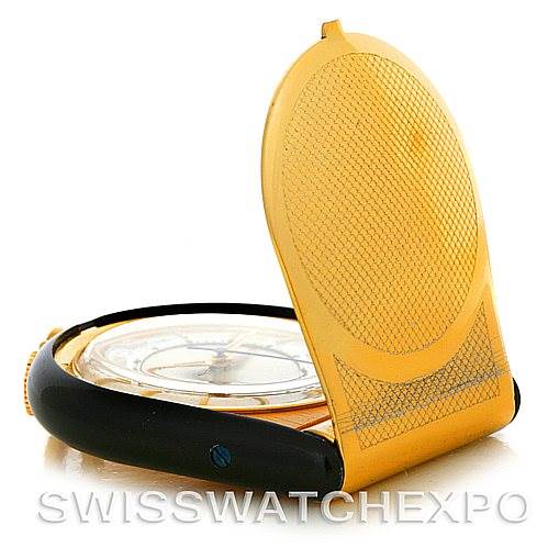 This image shows a Vintage Jaeger LeCoultre watch with its golden protective cover partially open, revealing the dial.