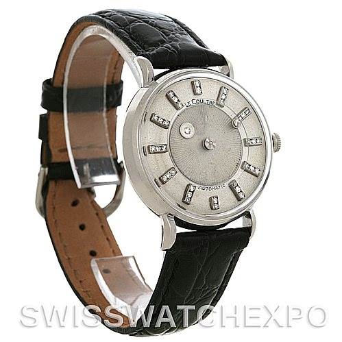 The image shows a side and frontal view of a Vintage Jaeger LeCoultre watch with a black leather strap and silver dial.