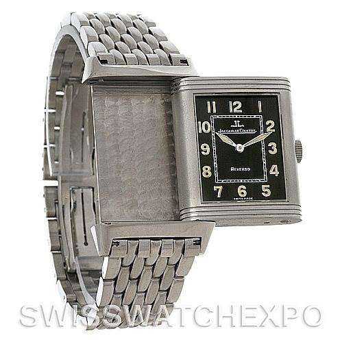 The image shows a Jaeger-LeCoultre Reverso watch in a partial open position, displaying its face and the inside of the reversible case.
