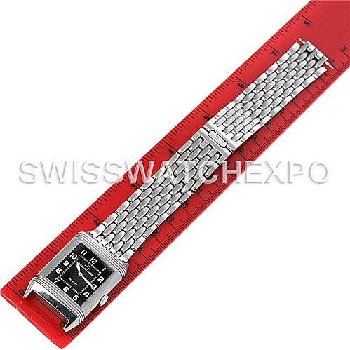 The image shows a full frontal view of a Jaeger LeCoultre Reverso 271.8.61 Men
s Stainless Steel Grey Dial 271.8.61 Men
s Stainless Steel Grey Dial watch, with its rectangular face and metal bracelet aligned next to a red ruler.