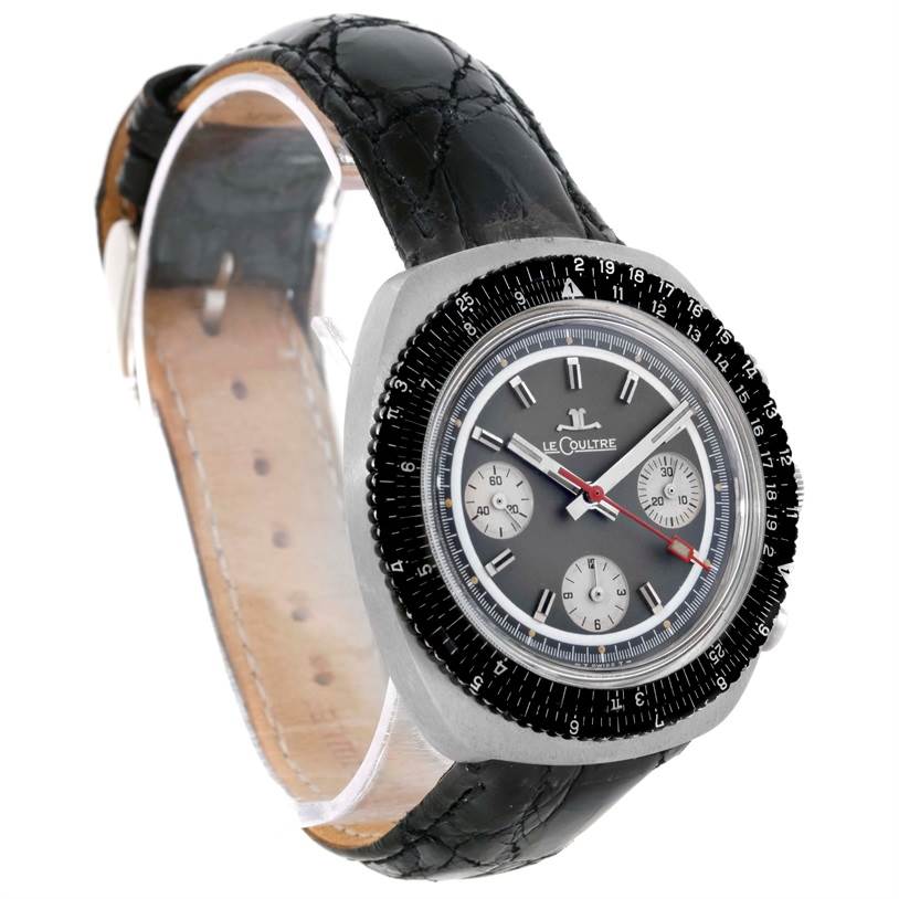 The image shows a Jaeger LeCoultre Vintage Men's Stainless Steel Grey Dial Men's Stainless Steel Grey Dial model watch at a three-quarter angle, displaying its face, bezel, and black leather strap.