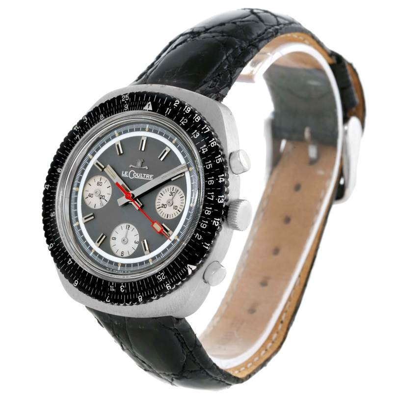 The Vintage Jaeger LeCoultre watch is shown at a three-quarter angle, highlighting its black strap, bezel, and grey dial.