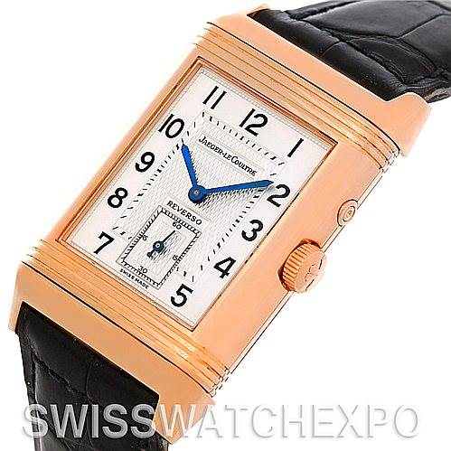 The image shows a Jaeger-LeCoultre Reverso model watch from a front angle, displaying the dial, gold case, crown, and black leather strap.