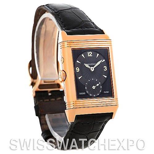 This is a side angle view of a Jaeger LeCoultre Reverso 270.254 Men's Rose Gold Silver Dial 270.254 Men's Rose Gold Silver Dial watch showcasing its dial, case, and leather strap.