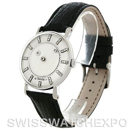 The image shows a side angle view of a Vintage Jaeger-LeCoultre watch, highlighting the watch face, case, crown, and leather strap.