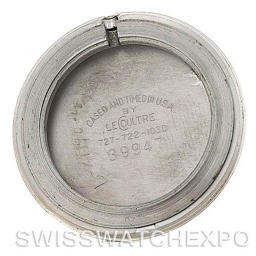 This image shows the back casing of a vintage Jaeger LeCoultre watch, displaying its internal engravings and serial number.