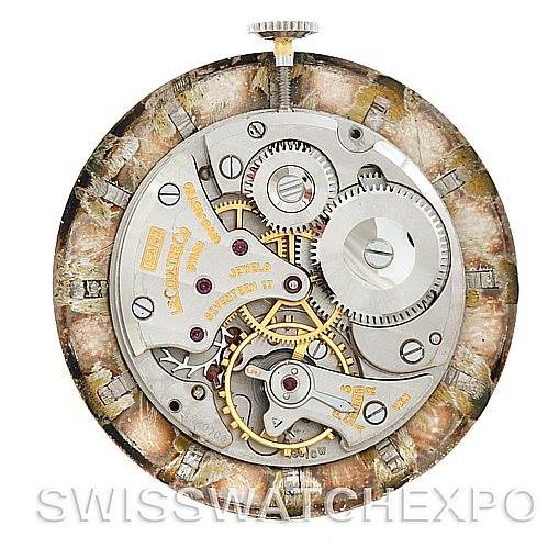 This image shows the internal mechanism and gears of a vintage Jaeger LeCoultre watch from a top-down angle.